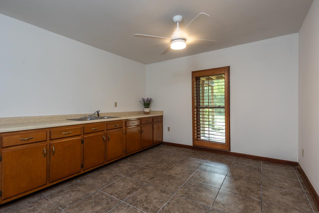 900 Center Point Drive Mason, TN 38049 - Photo 23 of 36 a view of an empty room with window and cabinet
