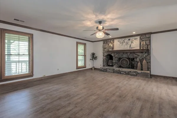 a view of a big room with windows