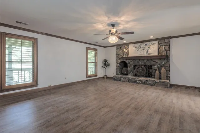 a view of a big room with windows