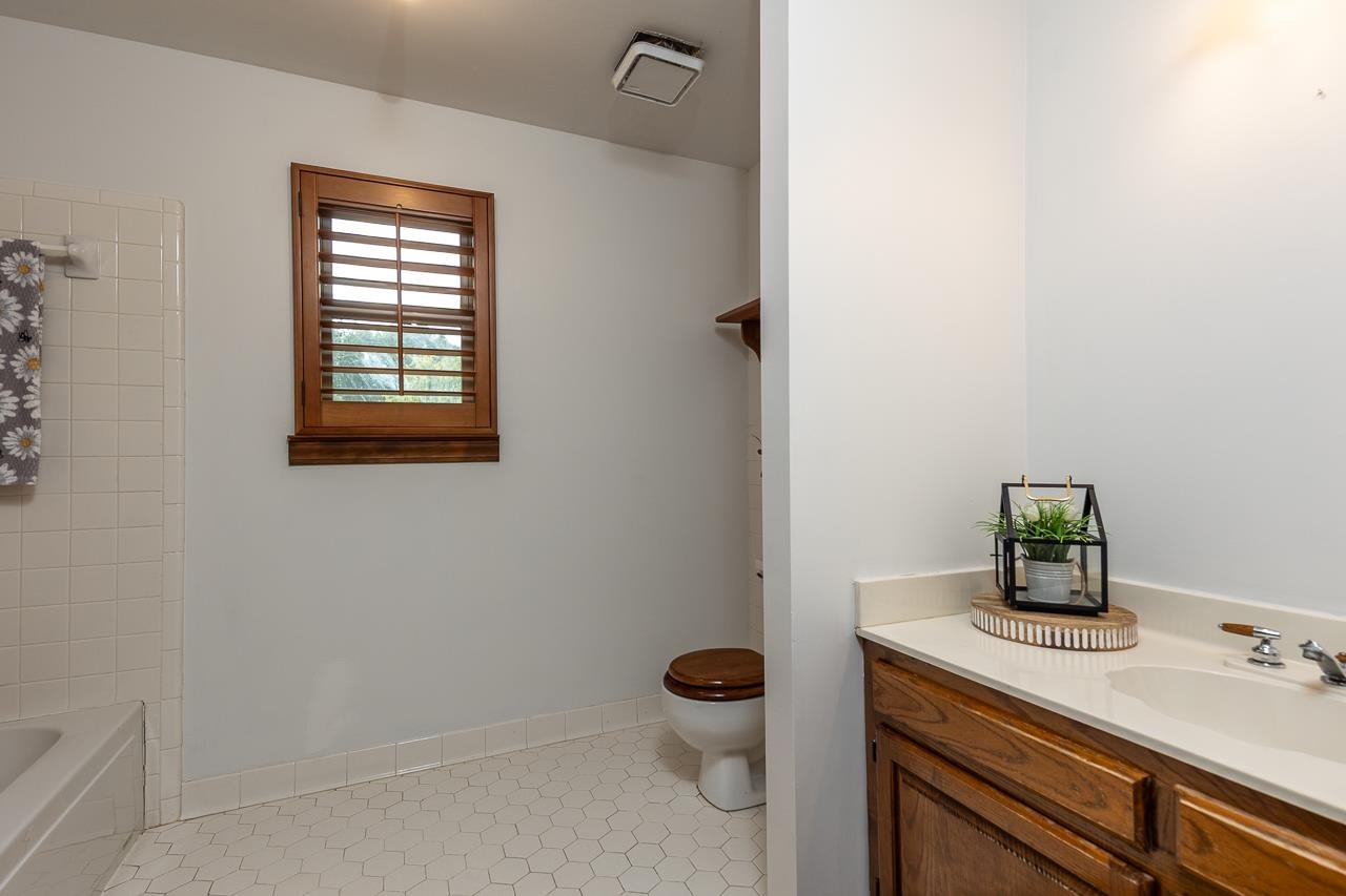900 Center Point Drive Mason, TN 38049 - Photo 28 of 36 a bathroom with a granite countertop toilet and sink