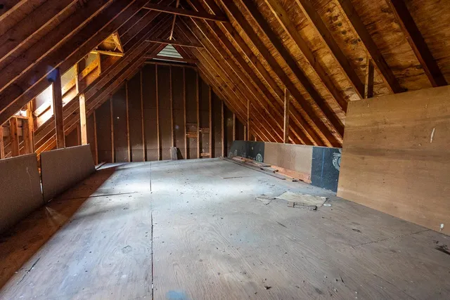 a view of a storage & utility room with a window