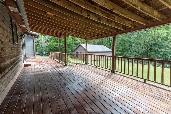 a view of porch with wooden floor in outdoor space