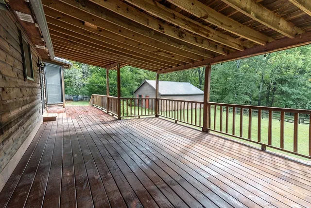 a view of porch with wooden floor in outdoor space