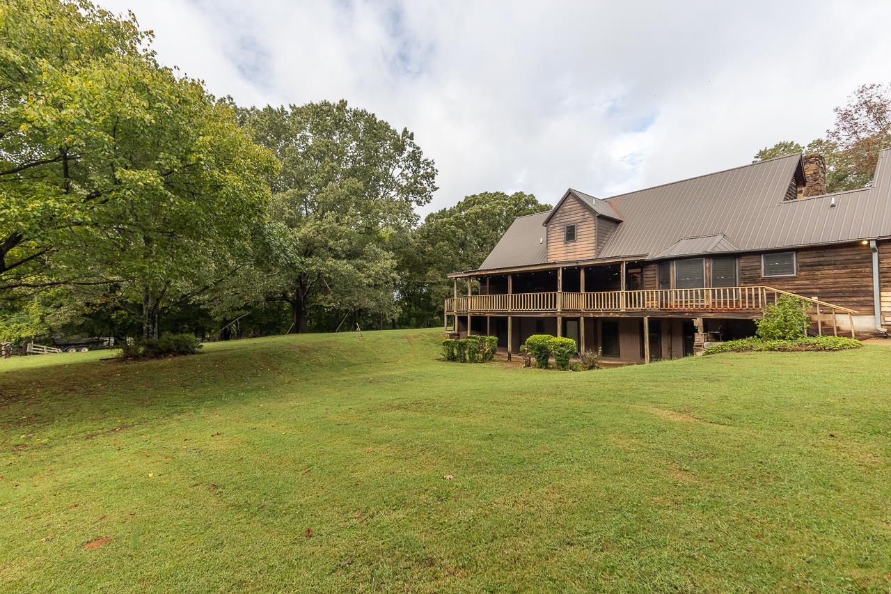 900 Center Point Drive Mason, TN 38049 - Photo 4 of 36 a front view of a house with a big yard