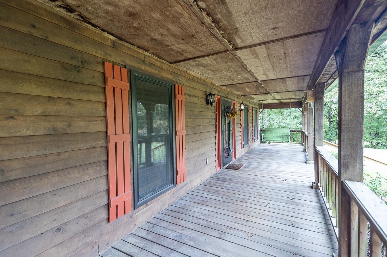 900 Center Point Drive Mason, TN 38049 - Photo 7 of 36 a view of a porch with wooden floor and city view
