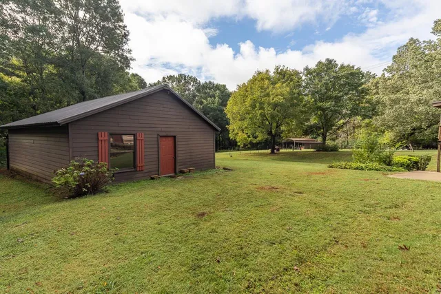 a kitchen with stainless steel appliances granite countertop a sink and cabinets