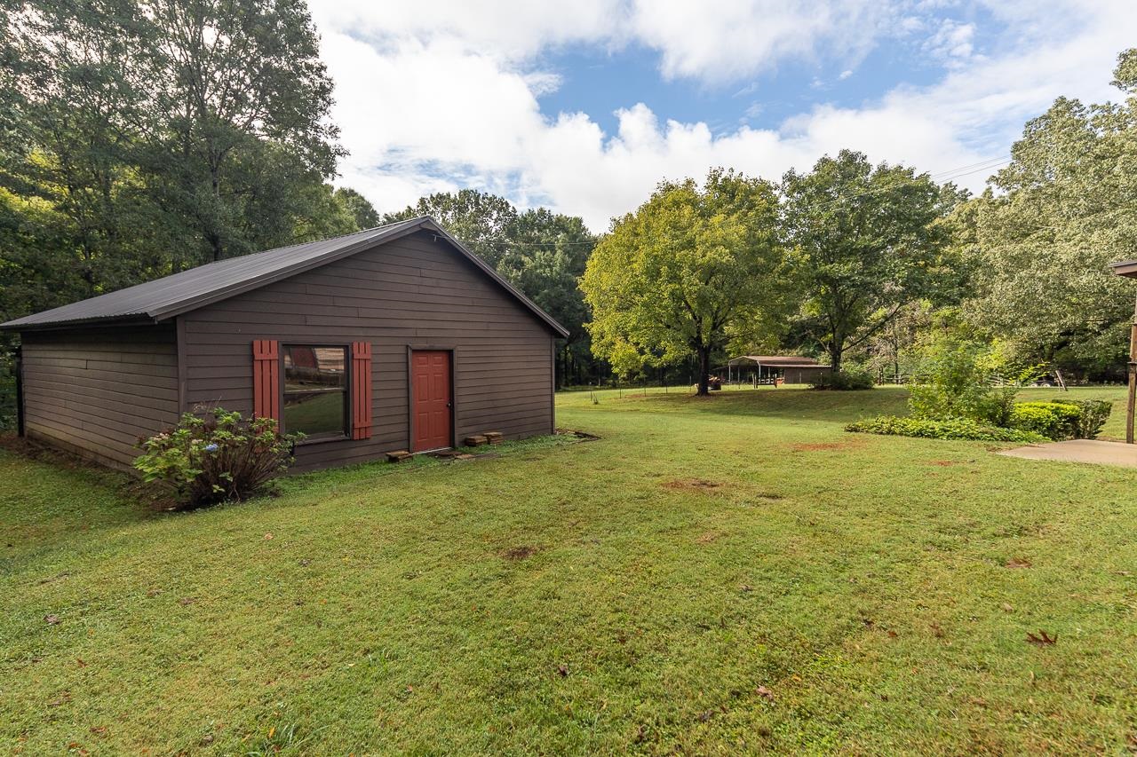 900 Center Point Drive Mason, TN 38049 - Photo 8 of 36 a view of a house with garden and yard