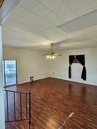 a view of a livingroom with wooden floor