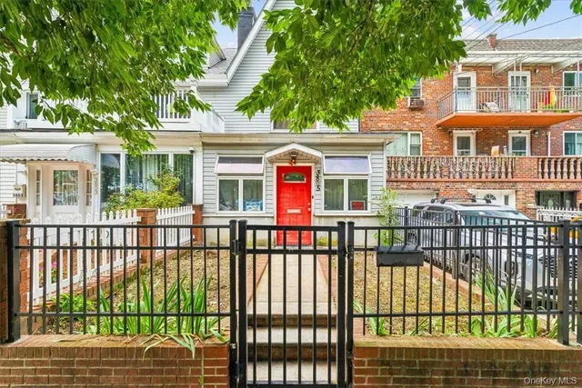 a view of a brick house with large windows