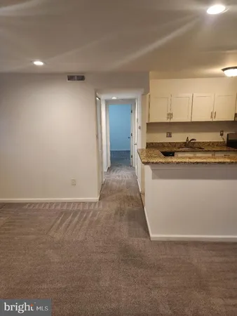 a view of a kitchen with a sink