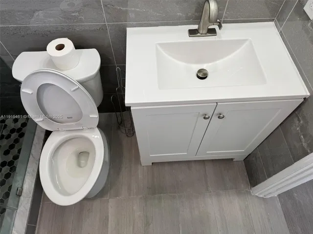 a bathroom with a sink and a washer