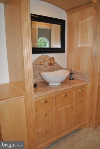 509 Brindley Place Southwest Leesburg, VA 20175 - Photo 17 of 30 His & Her Maple Vanities-Free Standing Sink