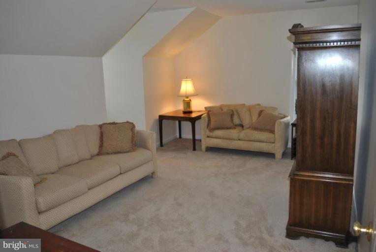 509 Brindley Place Southwest Leesburg, VA 20175 - Photo 27 of 30 Huge Bedroom with 2 Dormers and Lots of Storage.