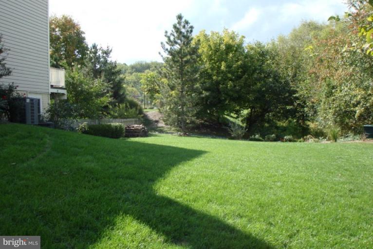 509 Brindley Place Southwest Leesburg, VA 20175 - Photo 4 of 30 Fenced Rear Yard that backs to Treed Common Area
