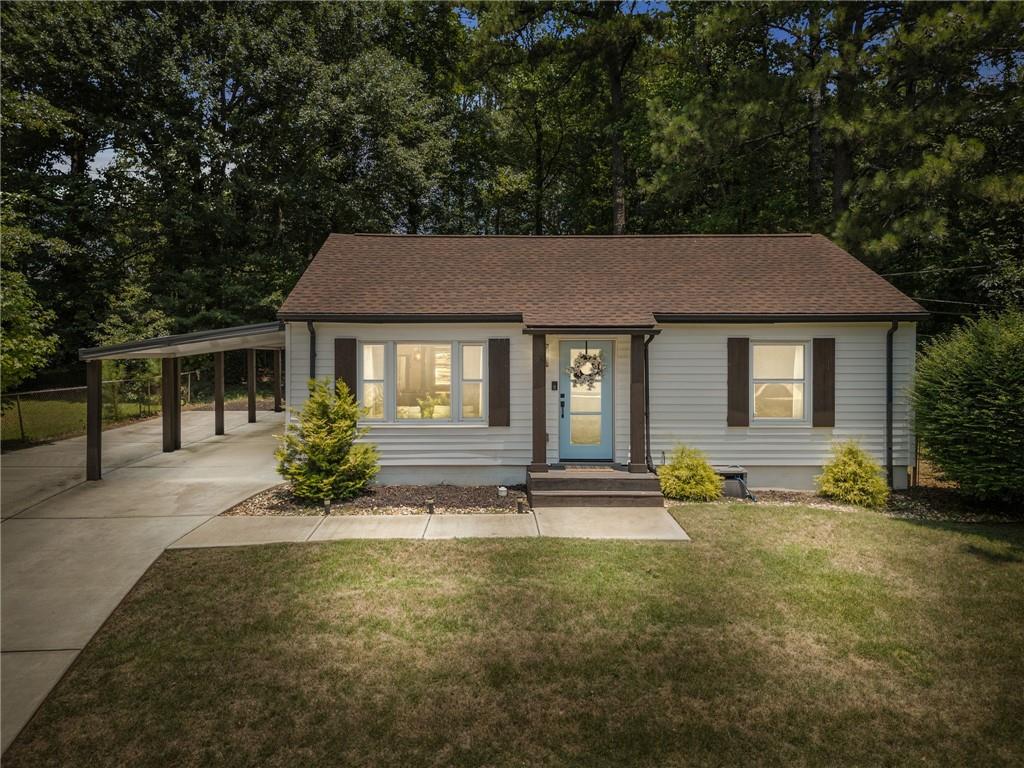 2347 Old Spring Road Smyrna, GA 30080 - Photo 1 of 1 a front view of a house with a yard
