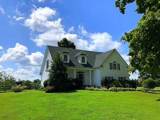 125 West Hester Road Cottontown, TN 37048 - Photo 2 of 28 a front view of a house with garden