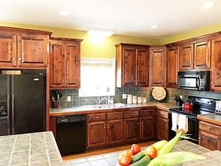 125 West Hester Road Cottontown, TN 37048 - Photo 11 of 28 a kitchen with granite countertop a refrigerator stove top oven and sink