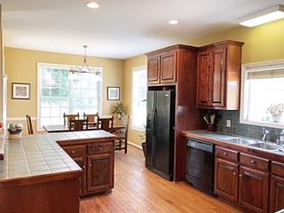 125 West Hester Road Cottontown, TN 37048 - Photo 12 of 28 a kitchen with stainless steel appliances granite countertop a sink stove and refrigerator