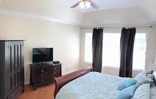 125 West Hester Road Cottontown, TN 37048 - Photo 15 of 28 a bedroom with a bed and a television in it