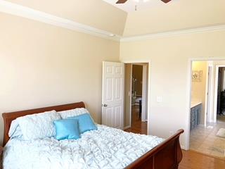 125 West Hester Road Cottontown, TN 37048 - Photo 16 of 28 a bedroom with a bed and wooden floor