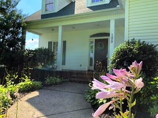 125 West Hester Road Cottontown, TN 37048 - Photo 3 of 28 a front view of a house with a yard