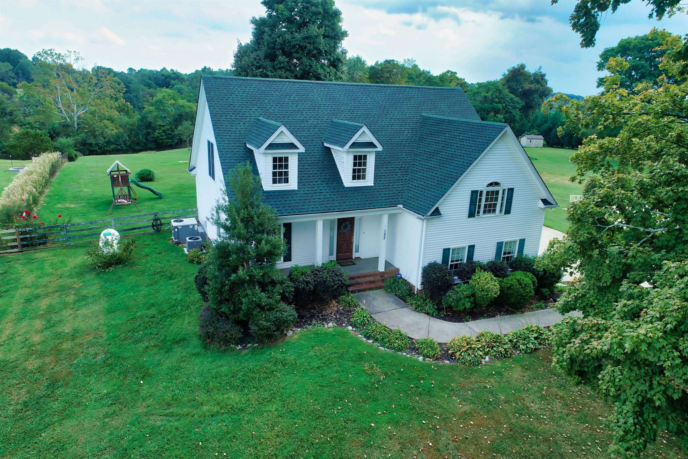 125 West Hester Road Cottontown, TN 37048 - Photo 24 of 28 a view of a house with a yard and potted plants