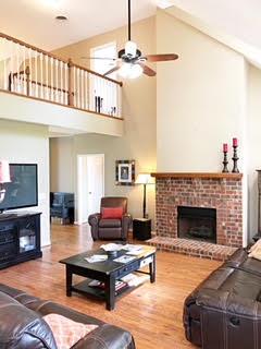 125 West Hester Road Cottontown, TN 37048 - Photo 7 of 28 a living room with furniture a fireplace and a ceiling fan