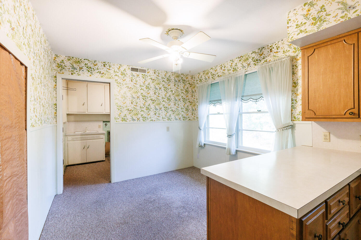 3308 37th Street Lubbock, TX 79413 - Photo 15 of 54 a view of a kitchen cabinets and wooden floor