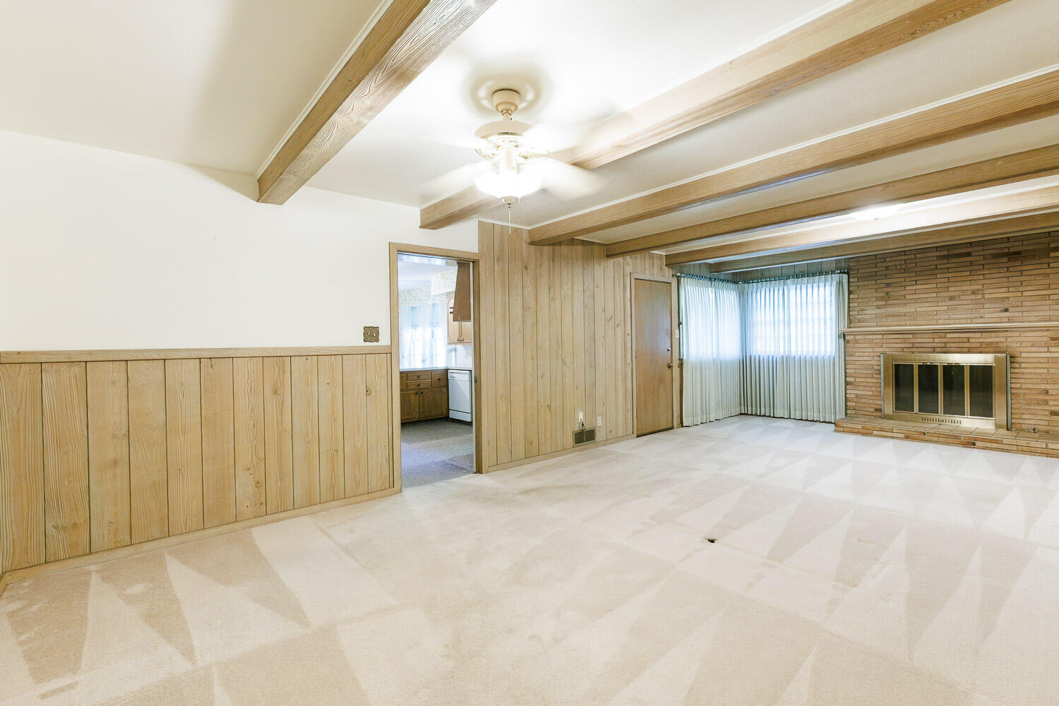3308 37th Street Lubbock, TX 79413 - Photo 18 of 54 a view of an empty room with a fireplace