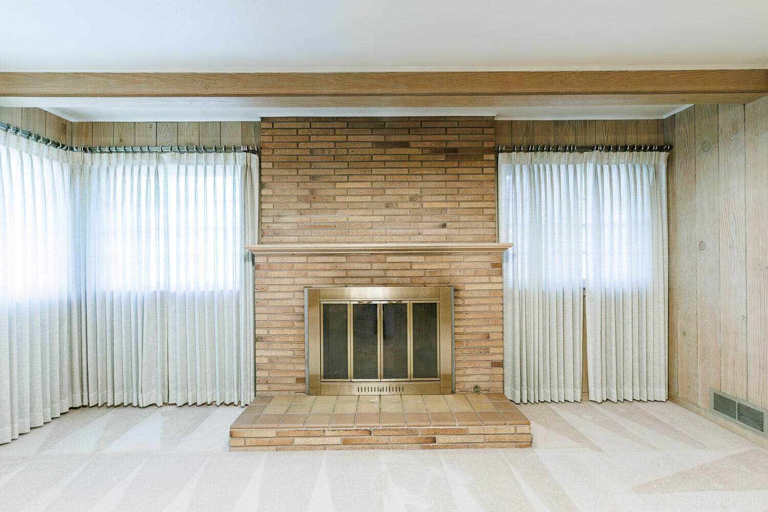 3308 37th Street Lubbock, TX 79413 - Photo 20 of 54 a view of fireplace with stairs and a window