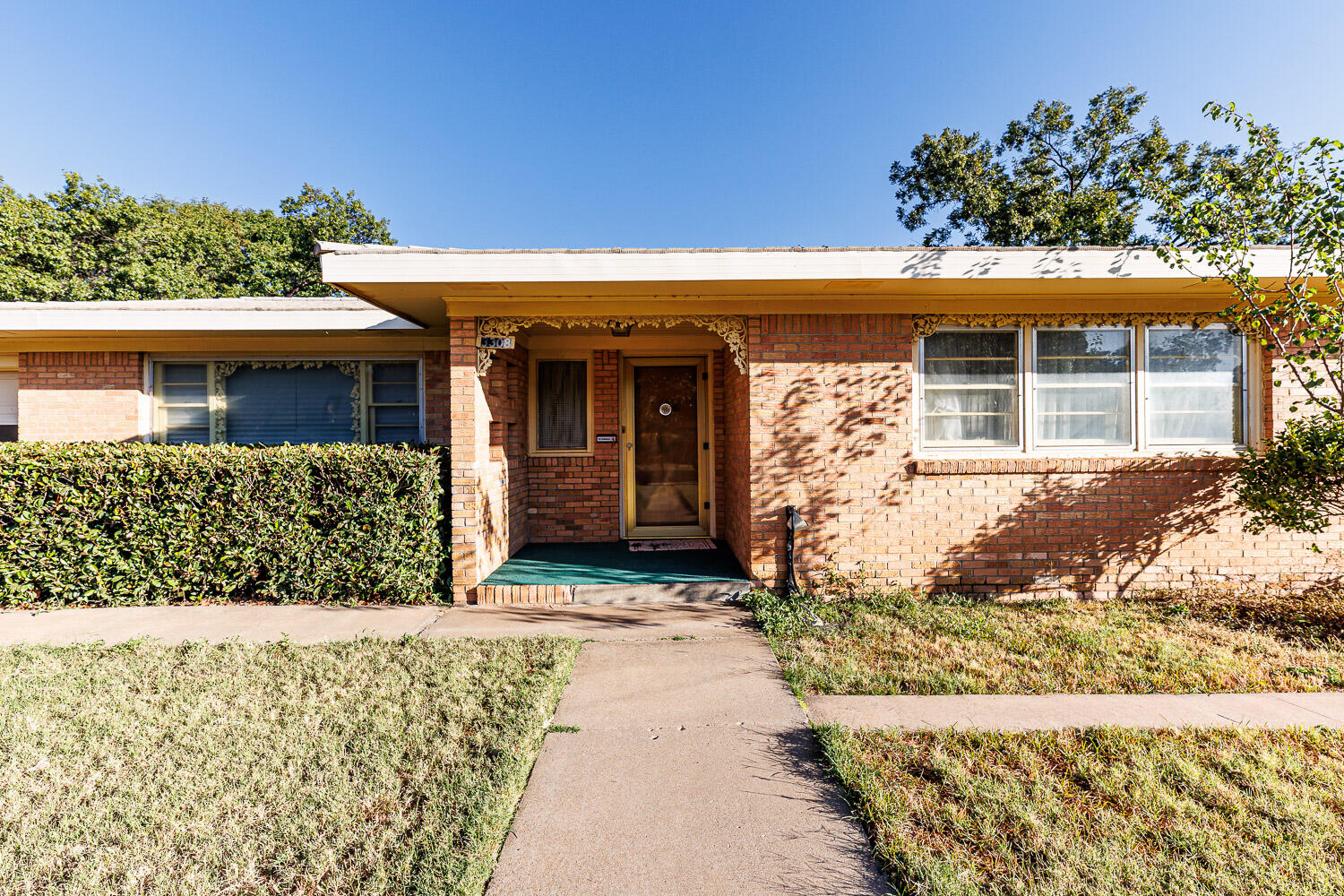 3308 37th Street Lubbock, TX 79413 - Photo 2 of 54 front view of a house with a yard