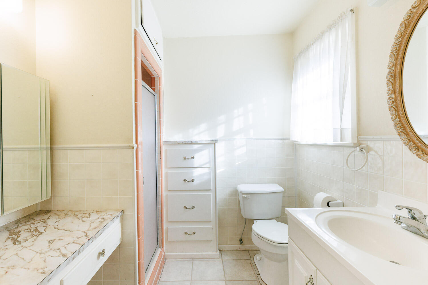 3308 37th Street Lubbock, TX 79413 - Photo 29 of 54 a bathroom with a sink and a mirror