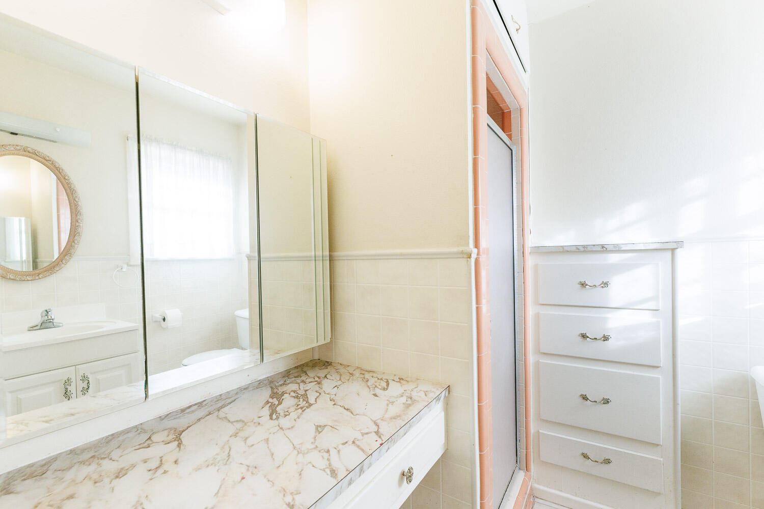 3308 37th Street Lubbock, TX 79413 - Photo 31 of 54 a bathroom with a bathtub and a shower
