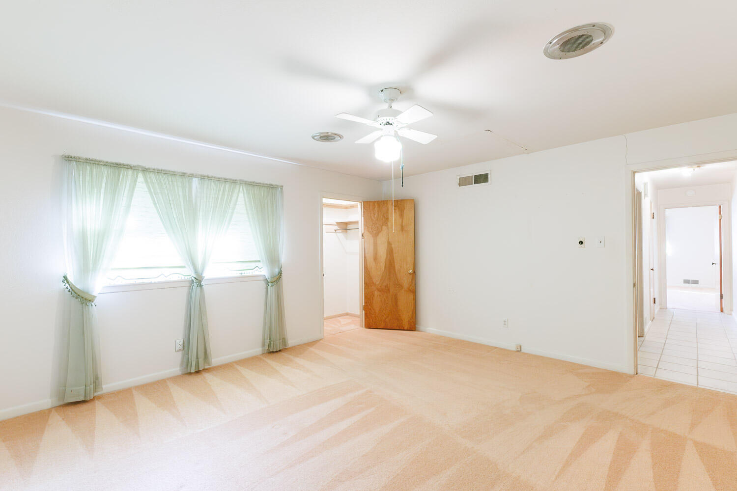3308 37th Street Lubbock, TX 79413 - Photo 34 of 54 a view of a room with window and ceiling fan