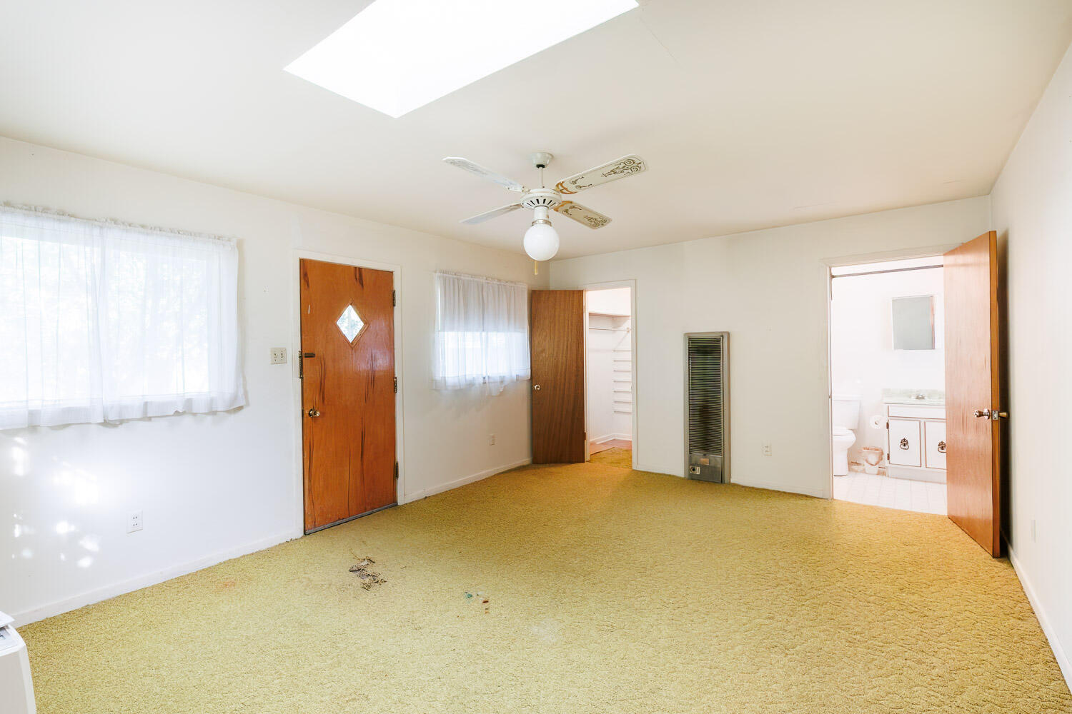 3308 37th Street Lubbock, TX 79413 - Photo 44 of 54 a view of an empty room with chandelier fan and windows