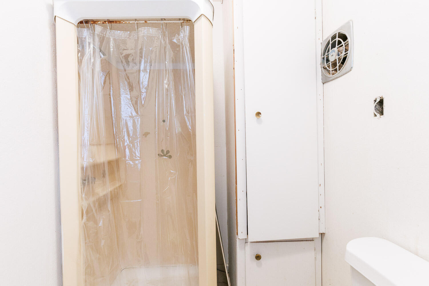 3308 37th Street Lubbock, TX 79413 - Photo 48 of 54 a bathroom with a shower curtain and a window