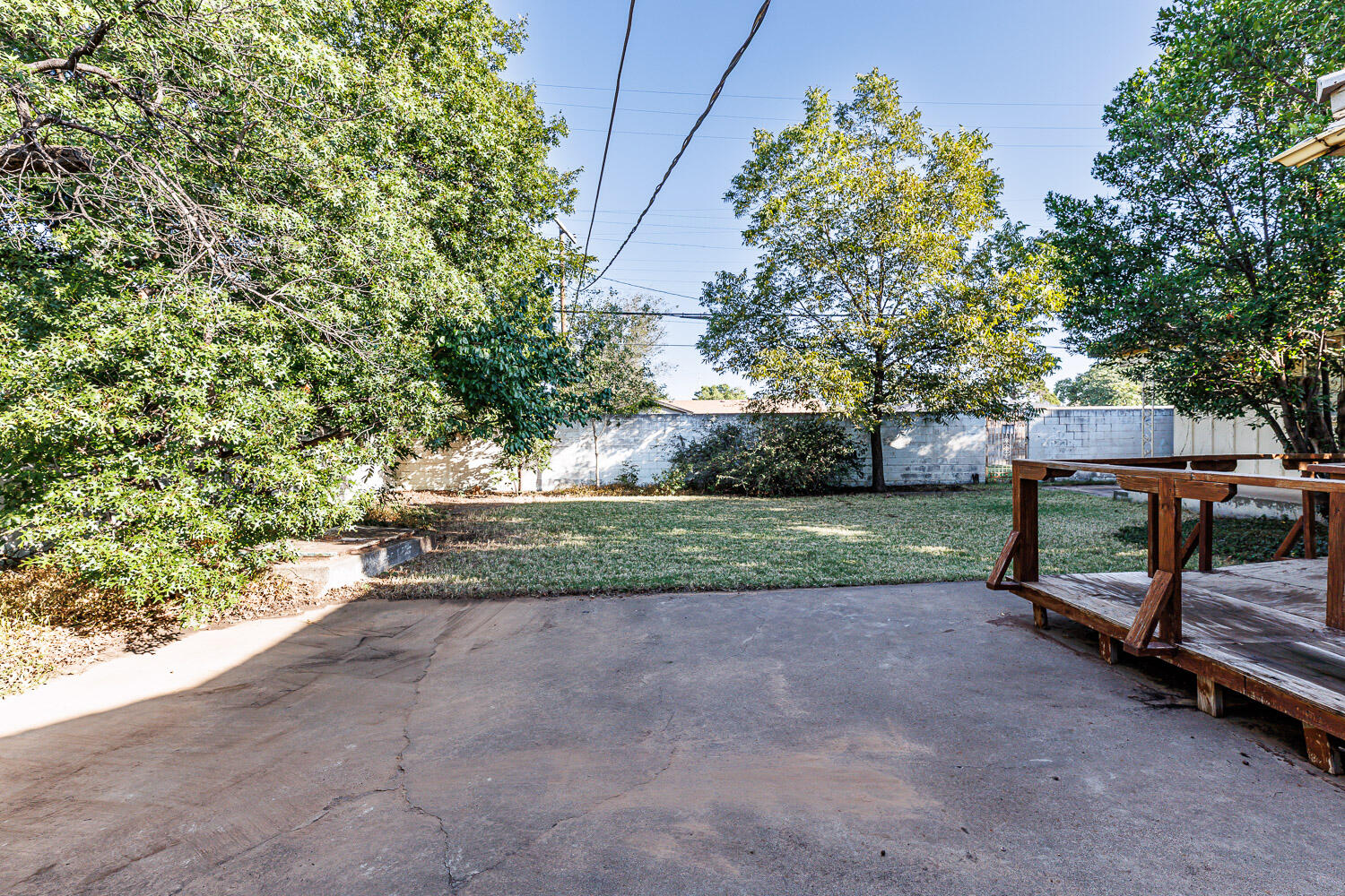 3308 37th Street Lubbock, TX 79413 - Photo 52 of 54 a park view with a bench and trees