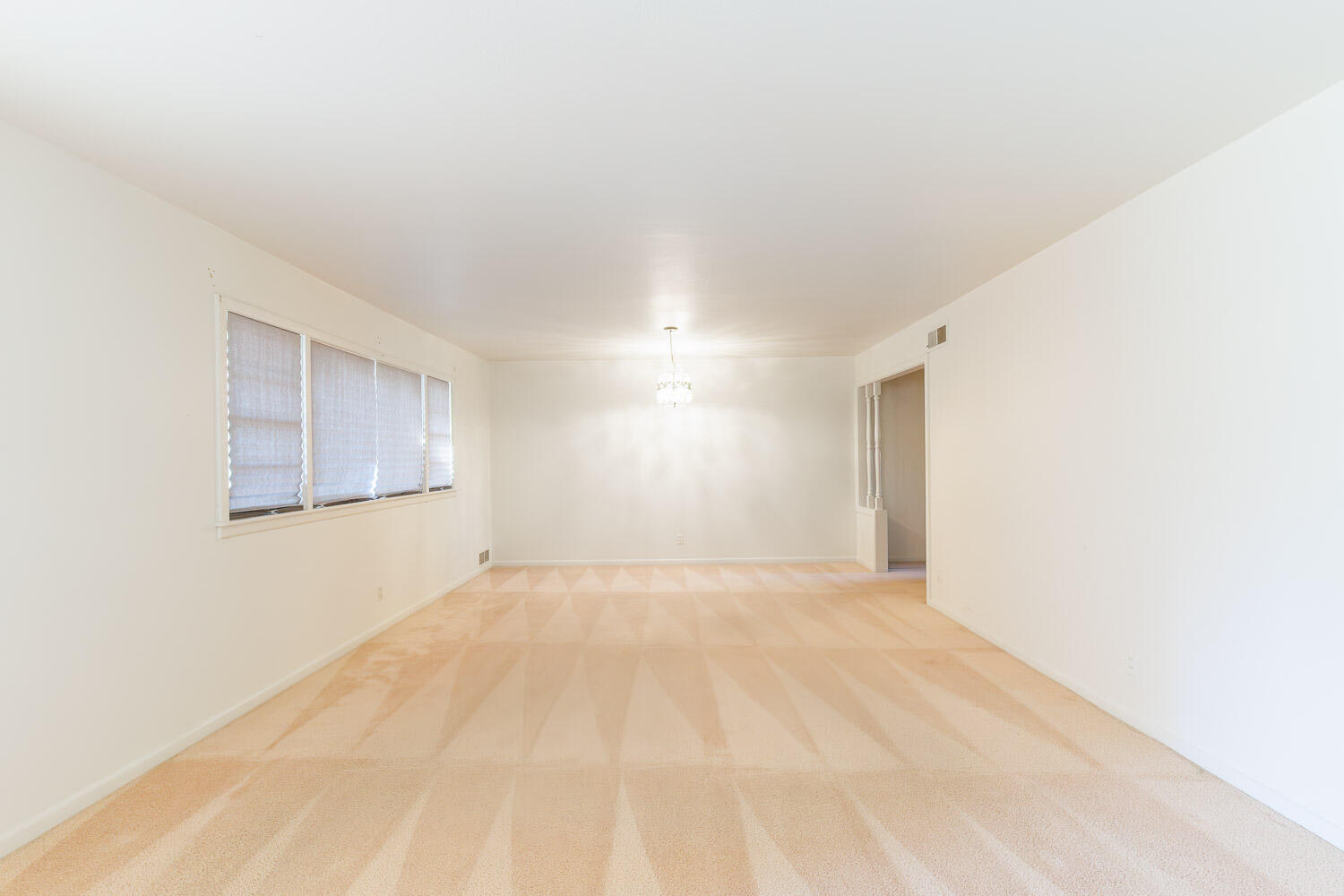 3308 37th Street Lubbock, TX 79413 - Photo 6 of 54 a view of an empty room with a window