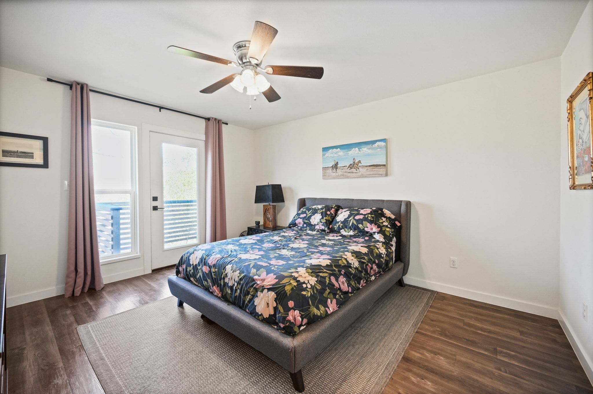 739 Pear Street Lockhart, TX 78644 - Photo 18 of 40 The light-filled primary suite features a private balcony with sweeping views of the expansive property.