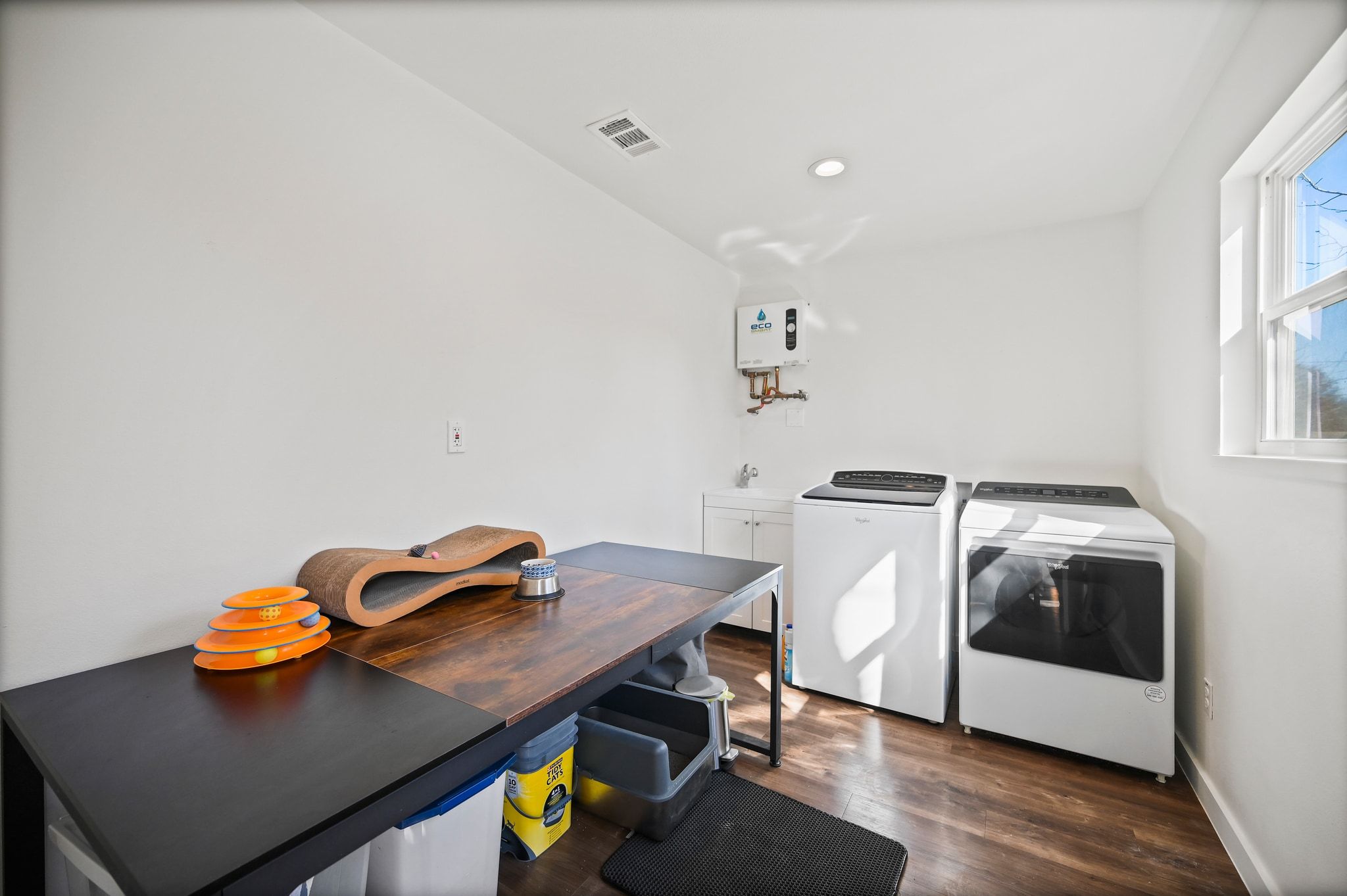 739 Pear Street Lockhart, TX 78644 - Photo 24 of 40 Notice the tankless water heater and storage potential in this space.