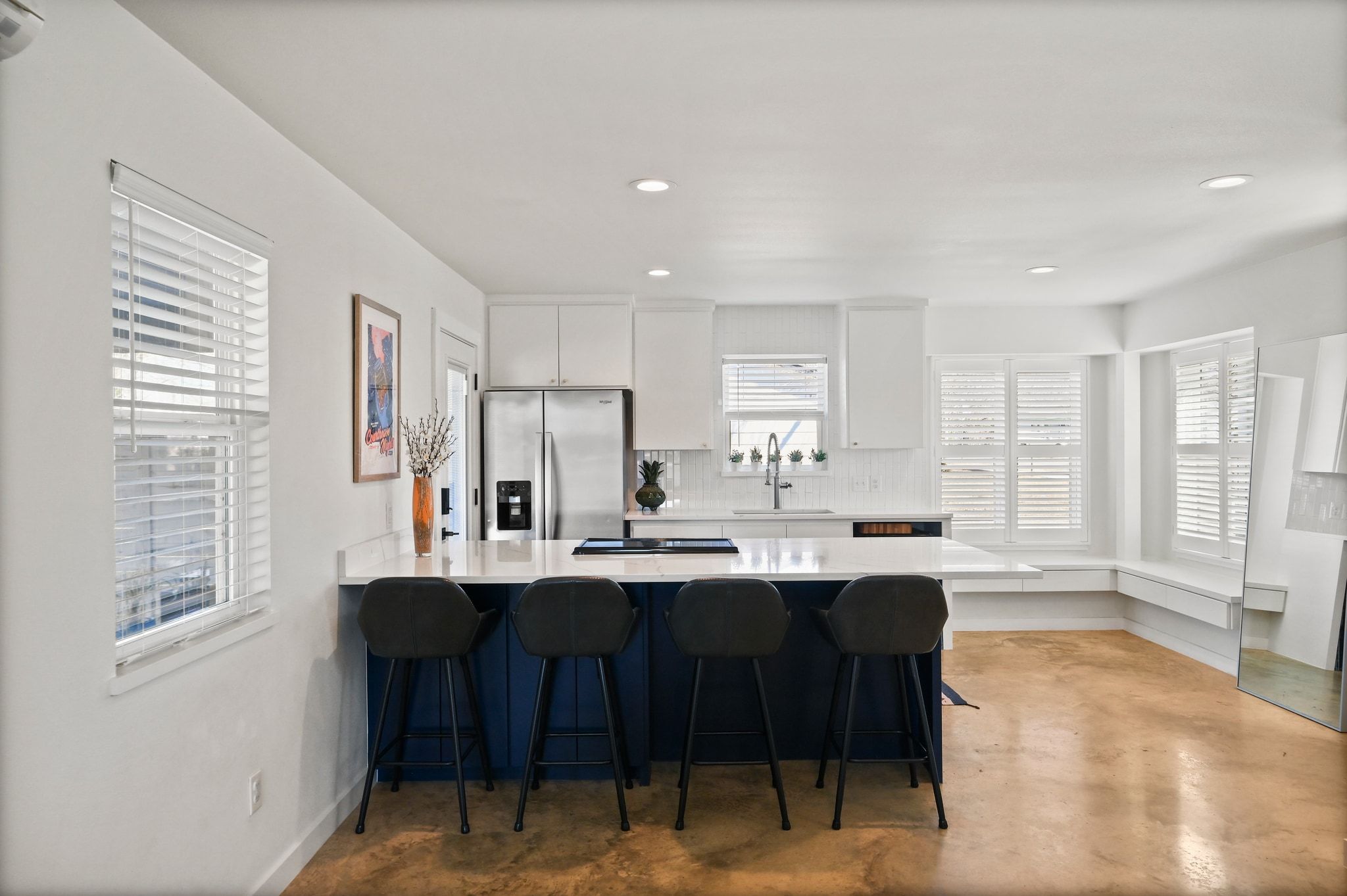 739 Pear Street Lockhart, TX 78644 - Photo 9 of 40 Take note of the corner windows and built-in window seats in the kitchen and the breakfast bar!