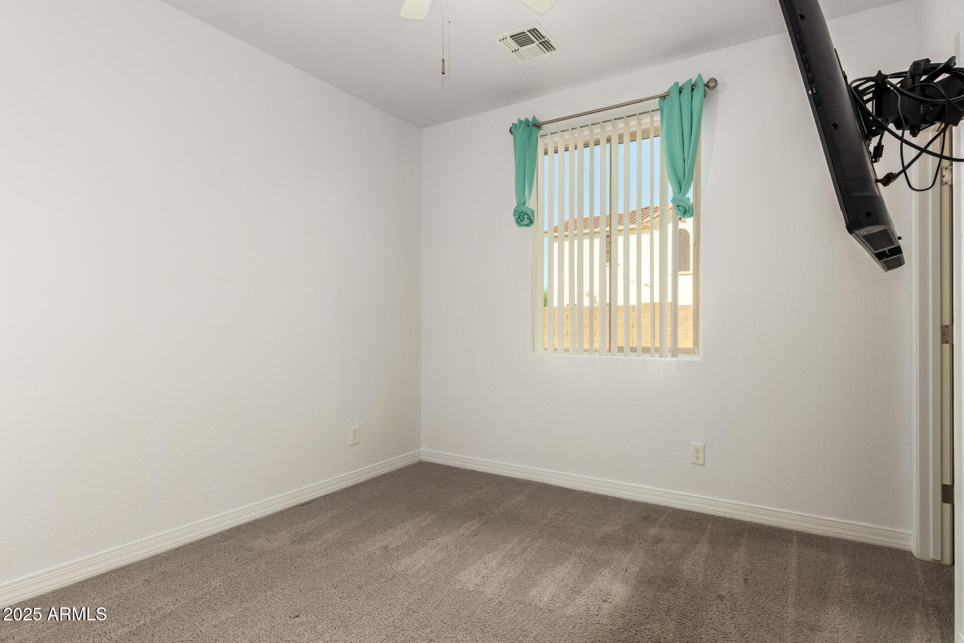 4515 West Pearce Road Laveen, AZ 85339 - Photo 18 of 35 an empty room with windows