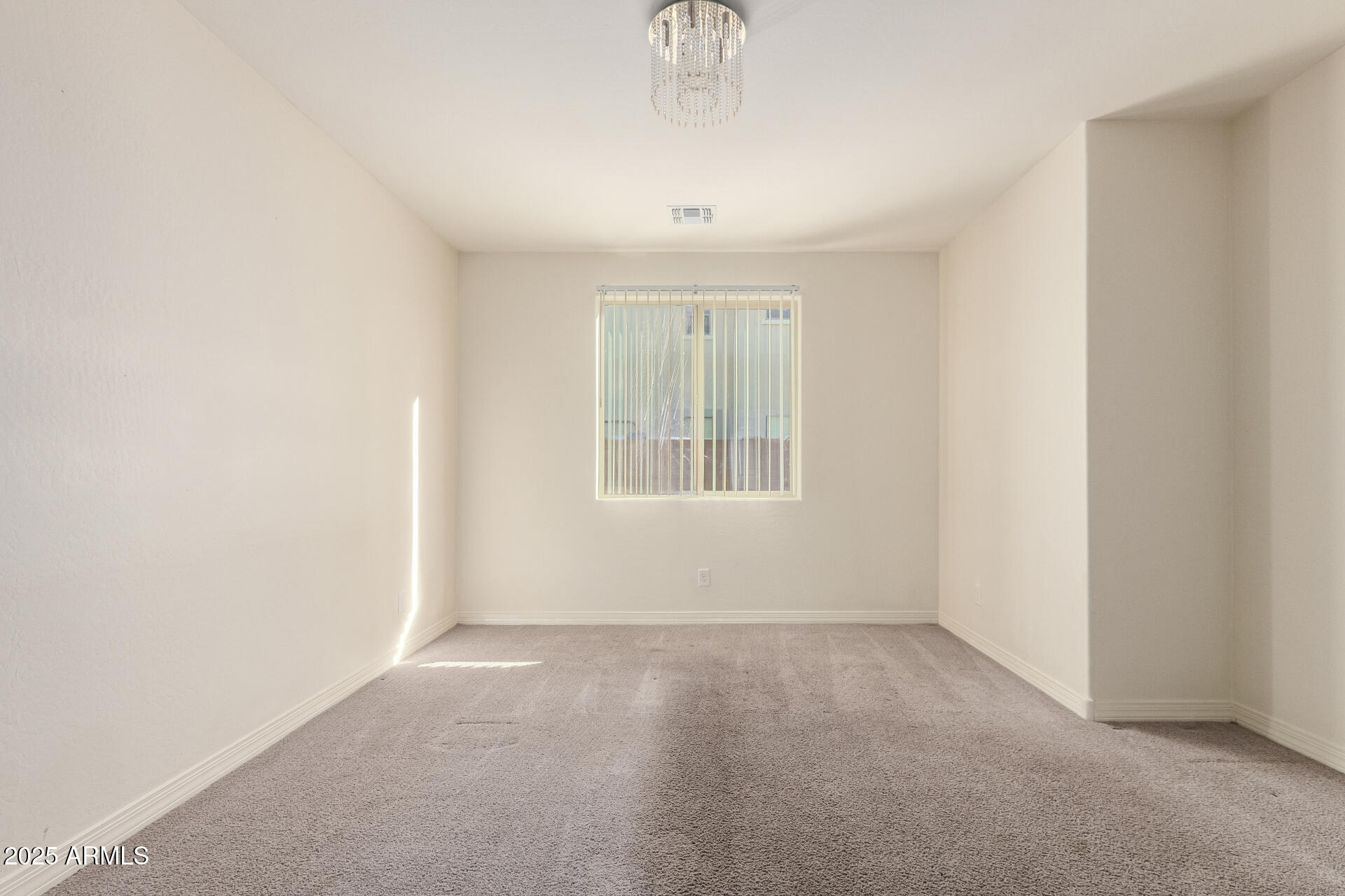 4515 West Pearce Road Laveen, AZ 85339 - Photo 25 of 35 an empty room with a window