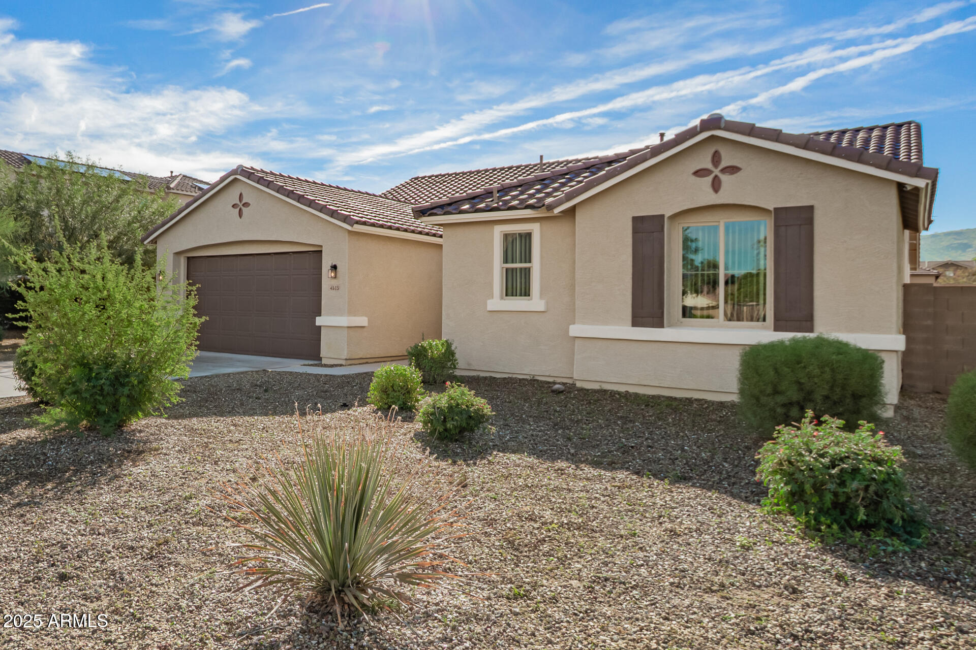 4515 West Pearce Road Laveen, AZ 85339 - Photo 34 of 35 a front view of a house with garden