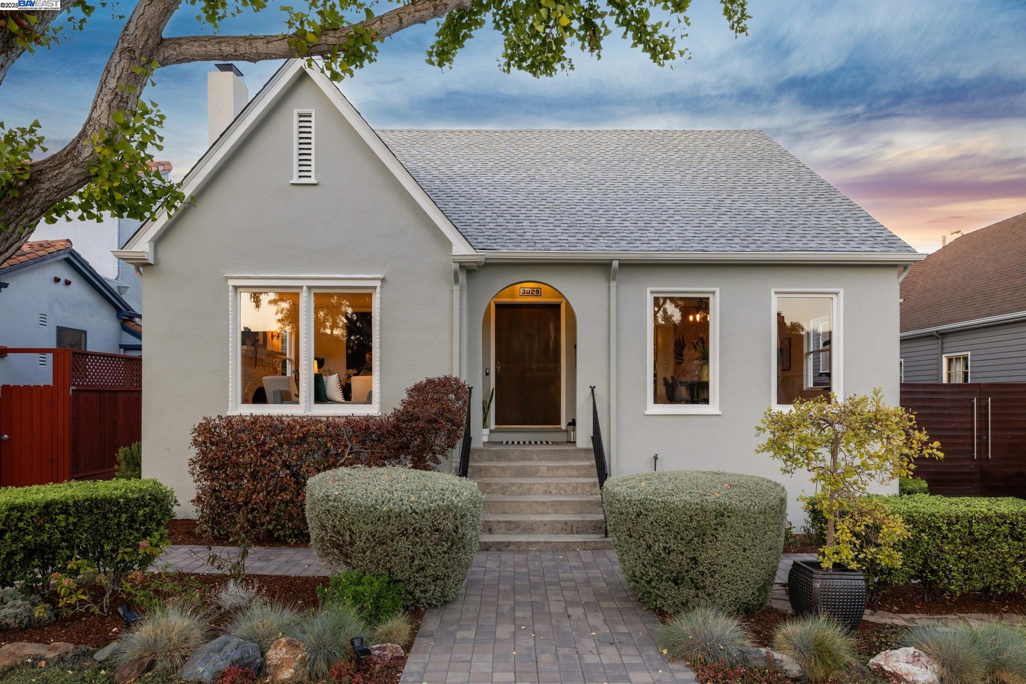 a front view of a house with garden