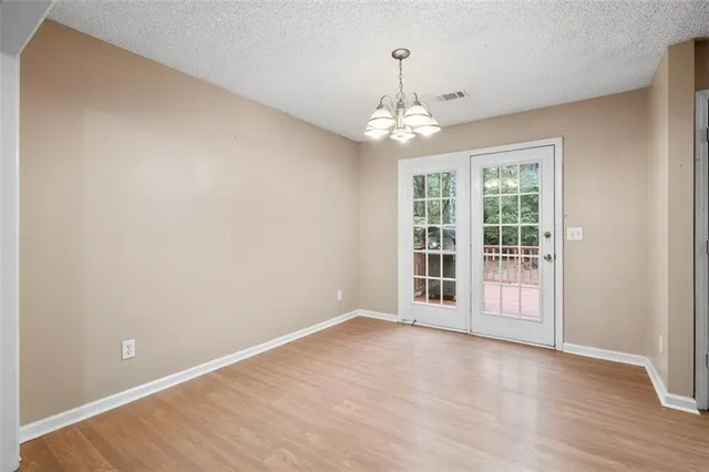 a view of an empty room with a window