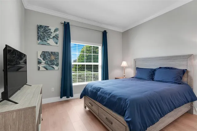 a view of a patio with a table and chairs and potted plants