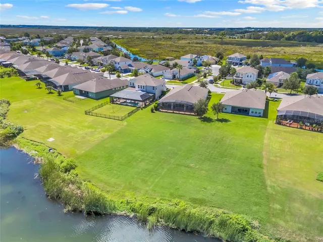 a view of a swimming pool with chairs