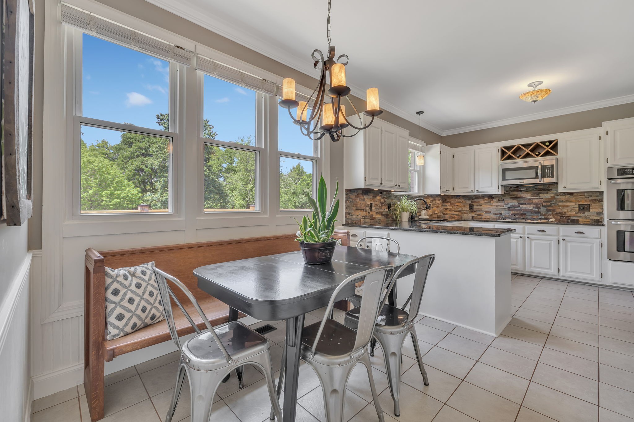 2226 Oakleaf Drive Franklin, TN 37064 - Photo 17 of 70 a dining room filled chandelier and kitchen view