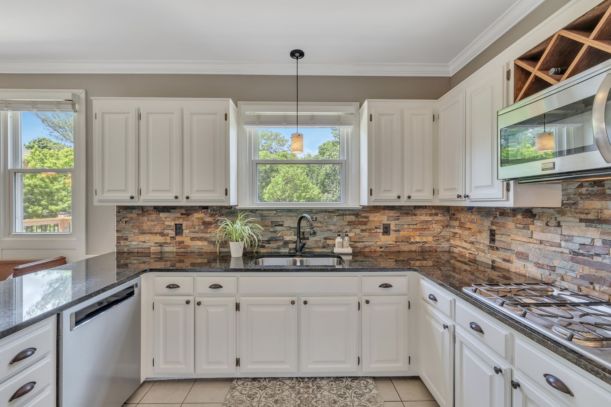 2226 Oakleaf Drive Franklin, TN 37064 - Photo 23 of 70 a kitchen with stainless steel appliances white cabinets and a window